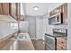 Functional kitchen featuring stainless steel appliances, wood cabinets, and laminate countertops at 2406 Brook Canyon Dr, Charlotte, NC 28212