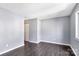 Bright living room with gray walls and dark laminate flooring at 2406 Brook Canyon Dr, Charlotte, NC 28212