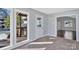 Bright sunroom with brick floors and access to the wood deck, main house, and views of the wooded yard at 2406 Brook Canyon Dr, Charlotte, NC 28212