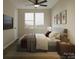 Cozy bedroom featuring a large window, ceiling fan and modern decor with neutral walls and colors at 2436 Arty Ave, Charlotte, NC 28208