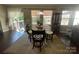 Bright dining area with a glass-top table set and lots of natural light from surrounding windows at 2640 Southern Trace Dr, Waxhaw, NC 28173