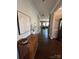 View down a long hallway with hardwood floors and an entry table at 2640 Southern Trace Dr, Waxhaw, NC 28173