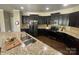 Modern kitchen featuring granite counters, an island with sink and modern appliances at 2640 Southern Trace Dr, Waxhaw, NC 28173