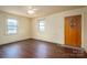 Bedroom with laminate floors and a brown door at 2915 Spencer Ne Rd, Conover, NC 28613