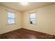 Bedroom with hardwood floors, and two windows at 2915 Spencer Ne Rd, Conover, NC 28613