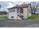 Exterior view of home with basement door and access stairs at 2915 Spencer Ne Rd, Conover, NC 28613