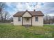 Charming single-story home with tan siding, a cozy front porch, and a well-manicured lawn at 2915 Spencer Ne Rd, Conover, NC 28613