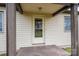 Welcoming front porch with sturdy columns, a secure storm door, and a classic exterior finish at 2915 Spencer Ne Rd, Conover, NC 28613