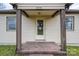 Inviting front porch featuring robust columns, a secure storm door, and an attractive exterior at 2915 Spencer Ne Rd, Conover, NC 28613