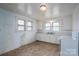 Simple kitchen featuring white cabinets, a practical layout, and ample natural light at 2915 Spencer Ne Rd, Conover, NC 28613