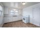 Cozy kitchen featuring white cabinets, a double sink, and an electric stove at 2915 Spencer Ne Rd, Conover, NC 28613