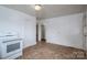 Bright kitchen with a white stove and linoleum floors at 2915 Spencer Ne Rd, Conover, NC 28613