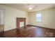 Charming living room with a decorative brick fireplace and hardwood floors at 2915 Spencer Ne Rd, Conover, NC 28613