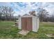 Outdoor storage shed with double doors and ramp, set on a grassy lot at 2915 Spencer Ne Rd, Conover, NC 28613