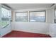 Sunroom with red painted floors, and multiple windows at 2915 Spencer Ne Rd, Conover, NC 28613