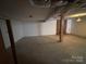 Unfinished basement with brick fireplace and concrete floor awaiting your personal touch at 356 Lucky Hollow Rd, Hickory, NC 28601