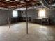 Spacious unfinished basement with workbench and shelving, offering ample storage at 356 Lucky Hollow Rd, Hickory, NC 28601