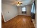 Spacious bedroom featuring a ceiling fan and hardwood floors, illuminated by natural light at 356 Lucky Hollow Rd, Hickory, NC 28601