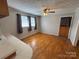 Sunny dining area with hardwood floors, a ceiling fan, and natural light at 356 Lucky Hollow Rd, Hickory, NC 28601