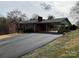 Exterior shot featuring covered parking and paved driveway at 356 Lucky Hollow Rd, Hickory, NC 28601