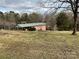 Exterior view of brick home with covered parking and a large yard at 356 Lucky Hollow Rd, Hickory, NC 28601