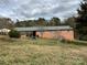 A brick home with a green roof, and a large covered area at 356 Lucky Hollow Rd, Hickory, NC 28601