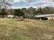 Spacious front yard and covered parking; beautiful countryside property in the background at 356 Lucky Hollow Rd, Hickory, NC 28601