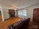 Comfortable living room with hardwood floors, fireplace and a leather sofa at 356 Lucky Hollow Rd, Hickory, NC 28601