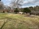 View of house behind a large yard and pile of tree debris at 356 Lucky Hollow Rd, Hickory, NC 28601