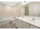 Bathroom with double vanity, a bath tub and a shower with glass door at 4528 Potters Glen Rd, Charlotte, NC 28269