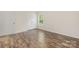 Bedroom with window and closet space, featuring stylish laminate flooring at 4528 Potters Glen Rd, Charlotte, NC 28269