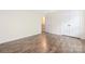 Bright bedroom with double door closet and warm wood flooring at 4528 Potters Glen Rd, Charlotte, NC 28269