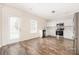 A kitchen features stainless steel appliances, white cabinets, and wood-look floors at 4528 Potters Glen Rd, Charlotte, NC 28269