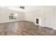 Living room with hardwood floors, a fireplace, a ceiling fan and natural light at 4528 Potters Glen Rd, Charlotte, NC 28269