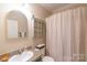 Neutral bathroom with a shower, white sink, and simple, clean design at 4605 Austin Rd, Monroe, NC 28112