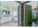 Bathroom featuring double sinks, a separate tub, and a walk-in closet at 4605 Austin Rd, Monroe, NC 28112