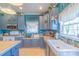 Well-lit kitchen featuring gray cabinets, modern appliances, and a functional layout at 4605 Austin Rd, Monroe, NC 28112