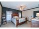 Relaxing main bedroom with a wooden bed frame, soft lighting, and neutral decor at 4605 Austin Rd, Monroe, NC 28112