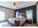 Inviting main bedroom with a wooden bed, soft bedding, and a calming atmosphere at 4605 Austin Rd, Monroe, NC 28112