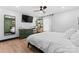 Bright bedroom with decoratively painted corner, hardwood floors, and a large window at 5501 Joyce Dr, Charlotte, NC 28215