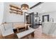 Cozy kitchen nook with a built-in bench, wooden table, and access to a pantry at 5501 Joyce Dr, Charlotte, NC 28215