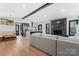 Inviting living space featuring a comfortable sectional sofa and seamless flow to kitchen at 5501 Joyce Dr, Charlotte, NC 28215