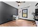 Well-lit home office with modern desk, chair, and window for a bright workspace at 5501 Joyce Dr, Charlotte, NC 28215