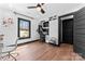 Bright home office space with ceiling fan, natural light, and hardwood flooring at 5501 Joyce Dr, Charlotte, NC 28215