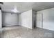 Versatile basement space with tiled flooring, offering potential for customization and various uses at 5807 Mctaggart Ln, Charlotte, NC 28269