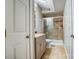 Updated bathroom with a marble-top vanity and a tiled walk-in shower with glass doors at 5807 Mctaggart Ln, Charlotte, NC 28269