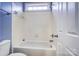This bathroom showcases a tiled shower and bathtub combination, perfect for relaxing after a long day at 5807 Mctaggart Ln, Charlotte, NC 28269