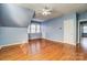 Spacious bonus room with hardwood floors, vaulted ceilings, ample natural light, and great layout flexibility at 5807 Mctaggart Ln, Charlotte, NC 28269