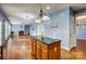 Open-concept kitchen island that flows into the living room, perfect for entertaining or casual dining at 5807 Mctaggart Ln, Charlotte, NC 28269