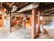 Basement with exposed brick pillars and ducts, ready for renovation and customization at 610 Hawthorne Ln, Charlotte, NC 28204